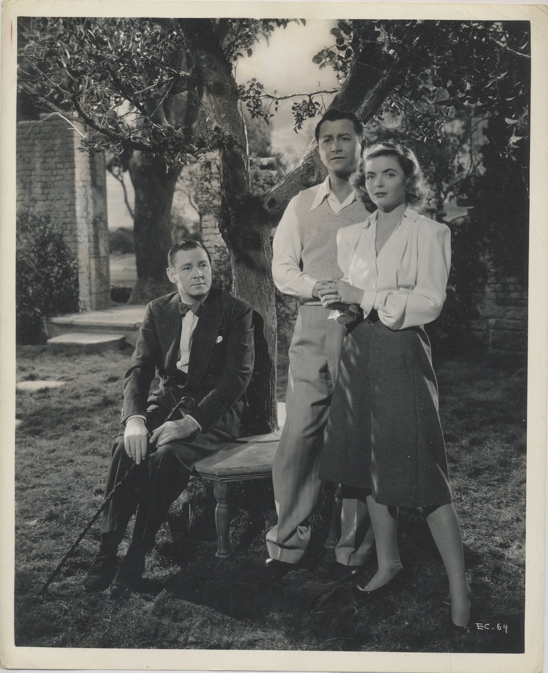 ENCHANTED COTTAGE. RKO PICTURES, 1945. ORIGINAL PRODUCTION PHOTO. Pictured, Dorothy McGuire, Robert Young, Herbert Marshall. Studio notes on the verso.